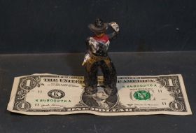 This $1 toy is a genuine mid-1950s lead cast, hand painted cowboy--and is about 2 1/2" in height.  What toys kids had then, and he just looked like he neededd a new home.  And the price was right.