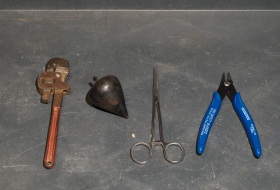 Just handtool goodies.  The 1920s plumb bob is going to be sprayed fluorescent orange, and used to correct paracord drops straight down for antenna work.